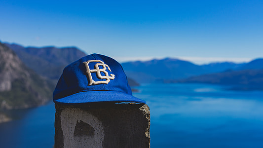 rule of thirds photography of blue fitted cap thumbnail