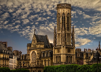brown cathedral under white clouds thumbnail