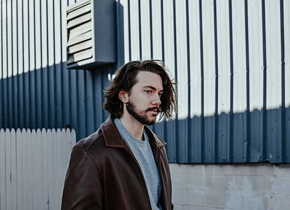man in brown leather jacket thumbnail