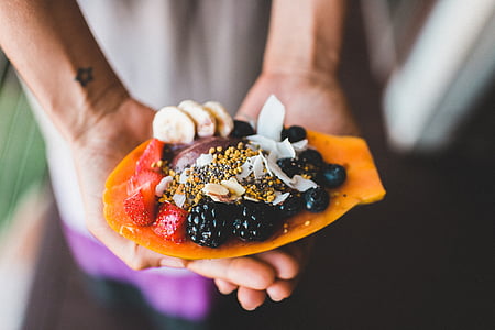 person holding dessert with mulberry thumbnail
