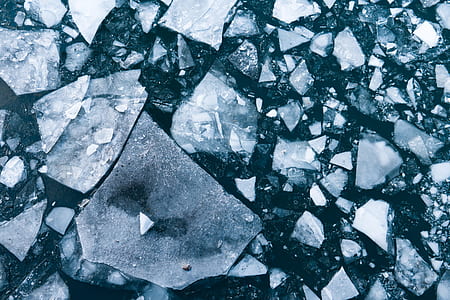 broken rocks lot on a body of water thumbnail