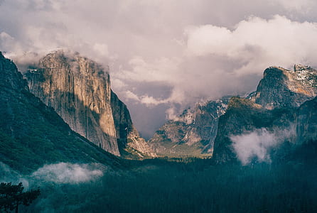 mountains under white cloudy sky thumbnail