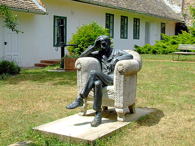 Babits Memorial House with man sitting in chair in Szekszárd, Hungary thumbnail