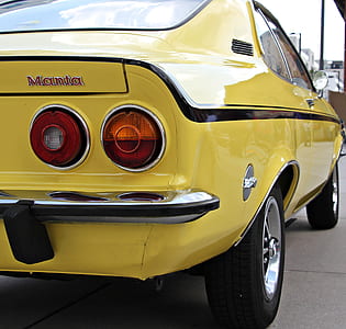 Yellow and Black Muscle Car Parked during Daytime thumbnail