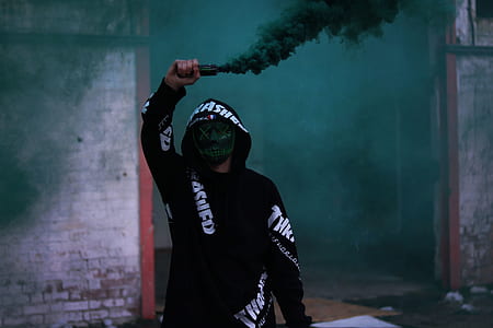 man holding smoke grenade thumbnail