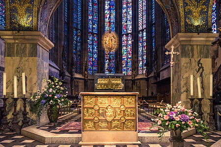 golden altar in stain glassed cathedral thumbnail