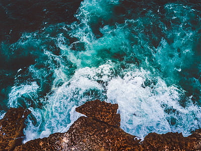 rock formation near the body of water thumbnail