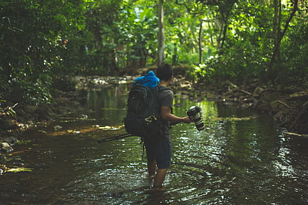 man standing on river thumbnail