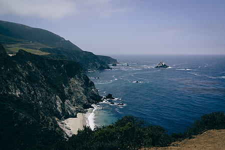 high-angle photography of cliff and sea thumbnail
