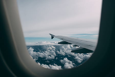 photo of plane wing and clouds thumbnail