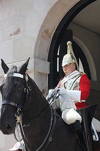 prince riding black horse near concrete wall thumbnail