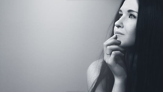 grayscale photo of black haired woman wearing ring thumbnail