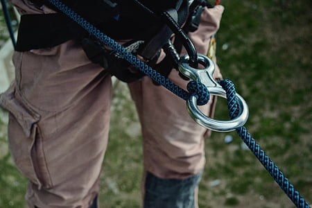 person wearing green rope harness thumbnail