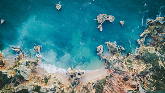 top view of sea shore during daytime thumbnail