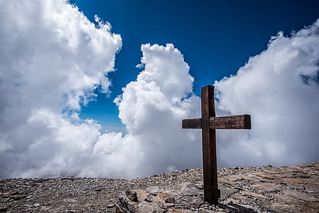 brown wooden cross taken at daytime thumbnail