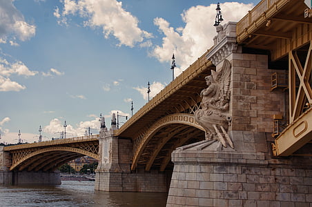 brown concrete bridge under blue sky during daytime thumbnail