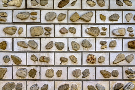 assorted-shape gray stone lot on white surface thumbnail