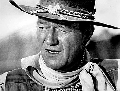 man wearing cowboy hat in grayscale thumbnail
