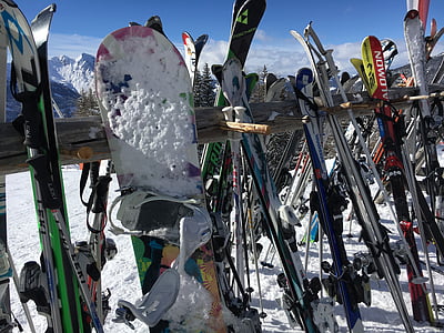 snowboard and skis on railings thumbnail