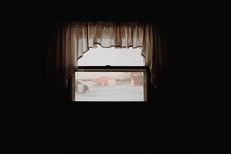 white curtain near white and red house at daytime thumbnail