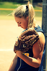 woman wearing brown leather catcher's mitt thumbnail