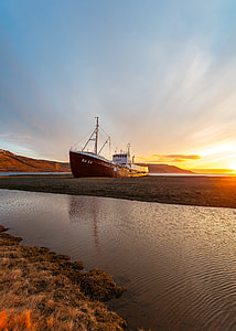 black and white ship on body of water during daytime thumbnail