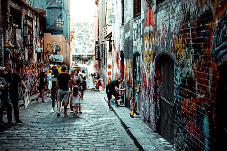 people standing near painted concrete walls thumbnail