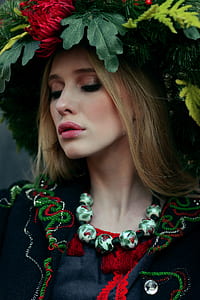 woman with flower headdress looking down thumbnail