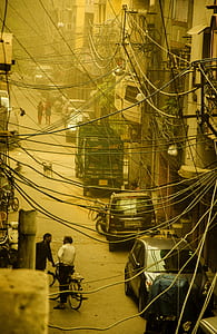 photography of parked vehicles beside buildings thumbnail