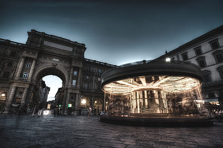 gray carousel near arch thumbnail