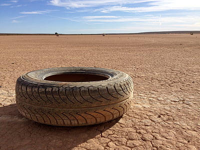 vehicle tire on brown sand thumbnail