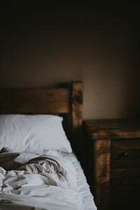 selective focus photography of white bed comforter thumbnail