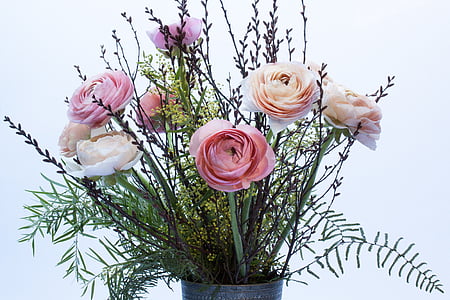 pink and white ranunculus flowers in gray vase thumbnail