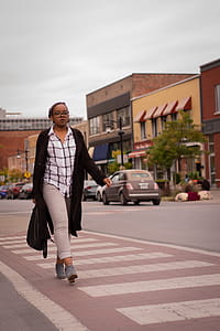 Woman Walking on Street Wearing Black Cardigan thumbnail