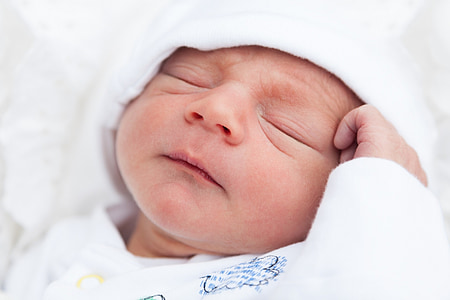 baby wearing white top thumbnail