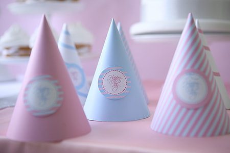 party hats on white wooden table thumbnail
