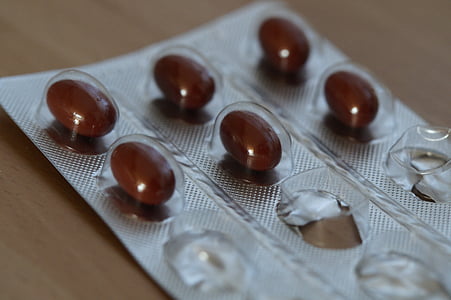 silver blister pack with brown medicine tablets thumbnail