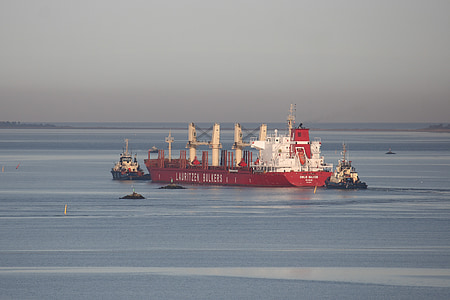 white and red metal boat on body of water thumbnail