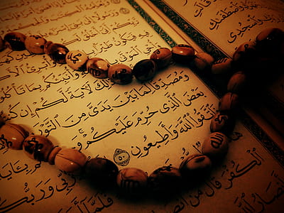 brown 33-count misbaha prayer beads on opened book thumbnail