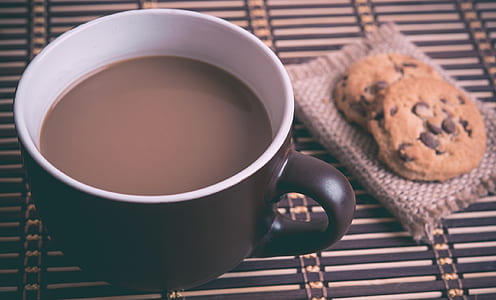 black ceramic mug filled with chocolate near cookies thumbnail