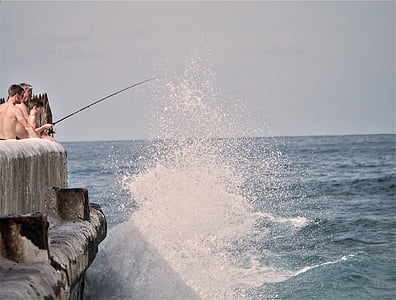 boys fishing during daytime thumbnail