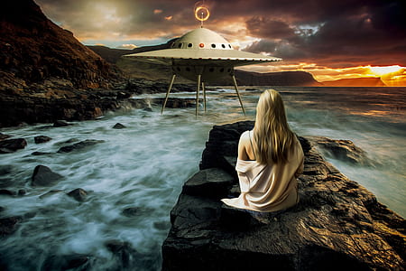 woman sitting on rock infront of UFO thumbnail