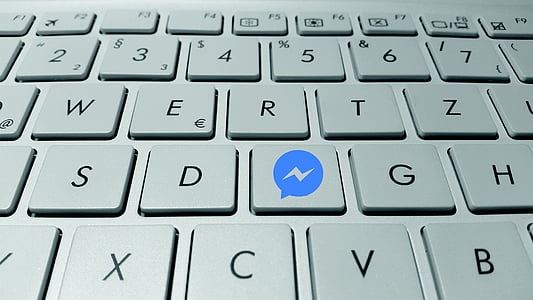 computer keyboard with messenger logo thumbnail