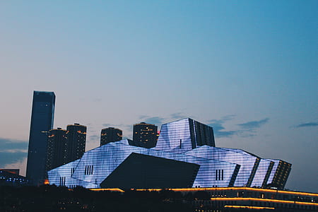 photo of glass building under sky thumbnail