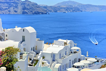 birds eye photography of white concrete house near body of water thumbnail