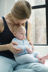 woman carrying baby thumbnail