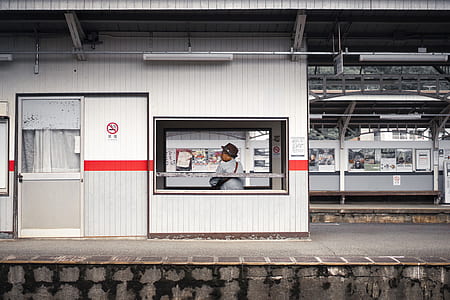 woman sitting on waiting shed in terminal thumbnail