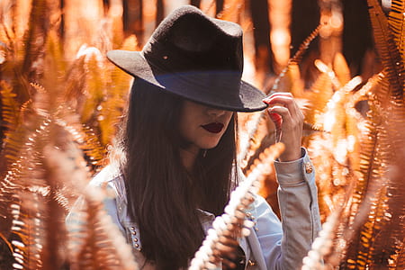 woman wearing black fedora hat during daytime thumbnail