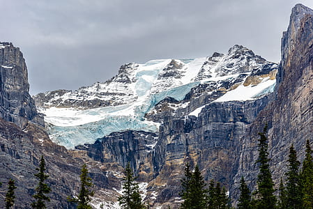 snow-capped mountain under gray clouds thumbnail