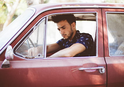 man riding in red vehicle thumbnail